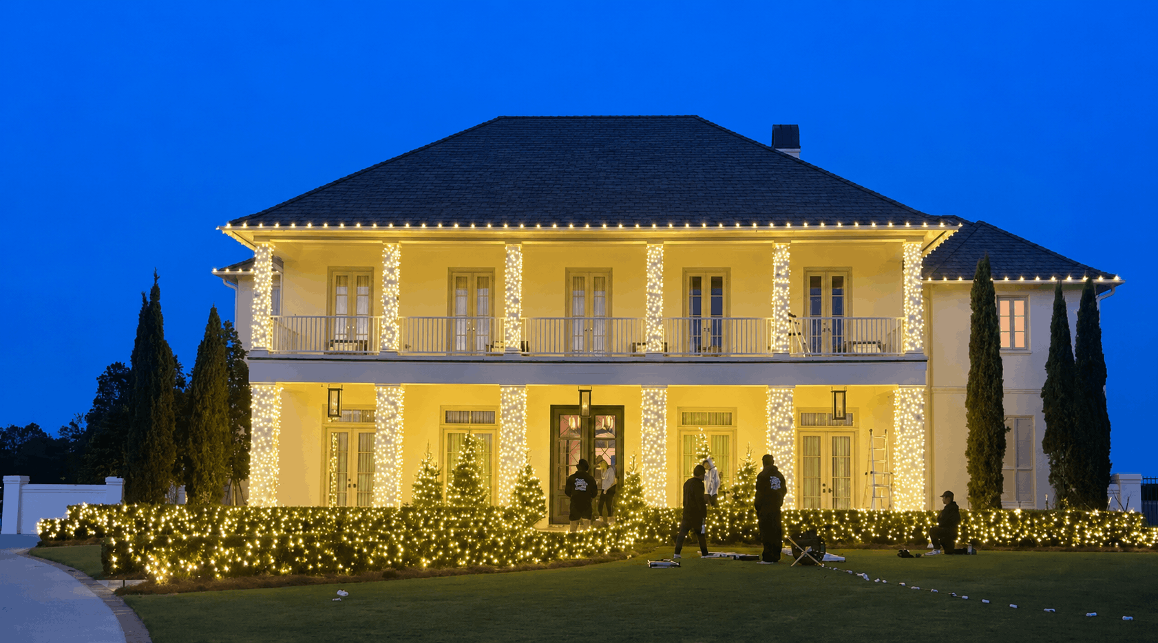 Warm white Christmas light display with large columns